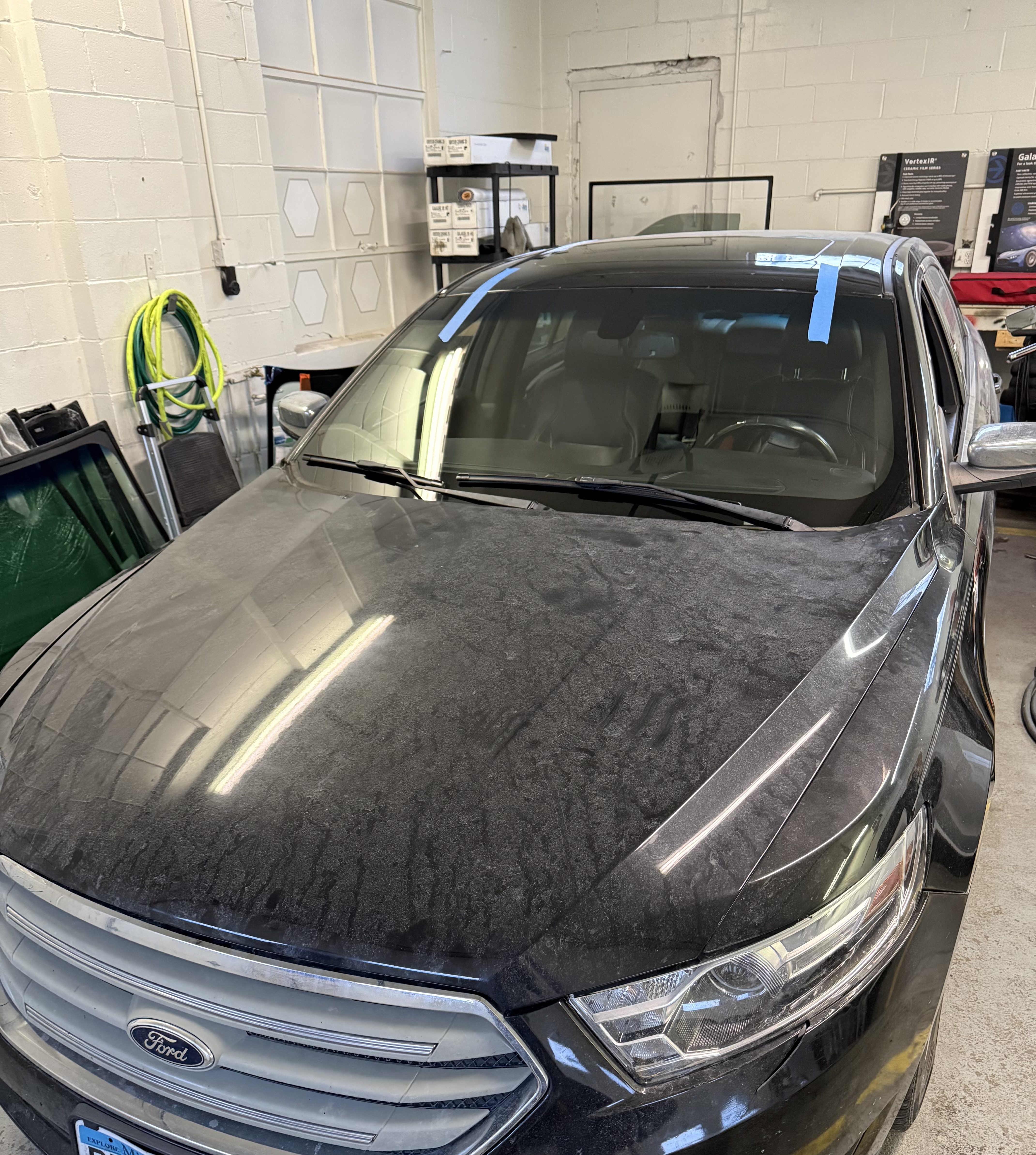 In-shop windshield replacement on black Ford by Chip Doctor of Sioux Falls