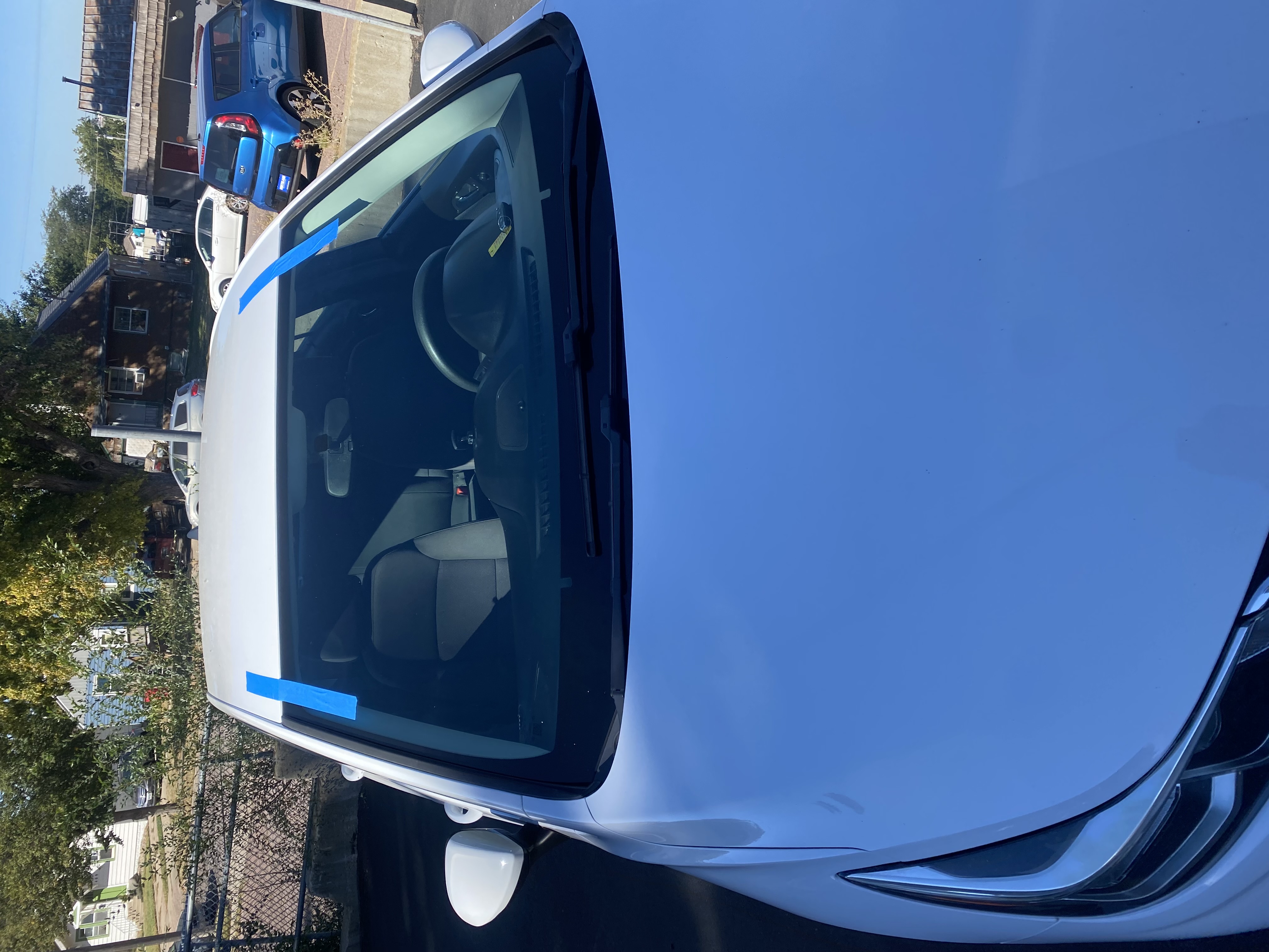 Windshield replacement on white car by Chip Doctor of Sioux Falls